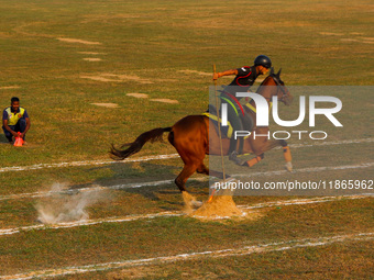 Soldiers of the armed forces perform acrobatic stunts on horses during practice for the Vijay Diwas celebration, as seen in Kolkata, India,...