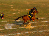 Soldiers of the armed forces perform acrobatic stunts on horses during practice for the Vijay Diwas celebration, as seen in Kolkata, India,...