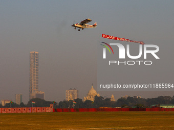 Indian army planes display maneuvers during a practice ahead of the Vijay Diwas celebration in Kolkata, India, on December 14, 2024. (