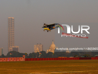 Indian army planes display maneuvers during a practice ahead of the Vijay Diwas celebration in Kolkata, India, on December 14, 2024. (