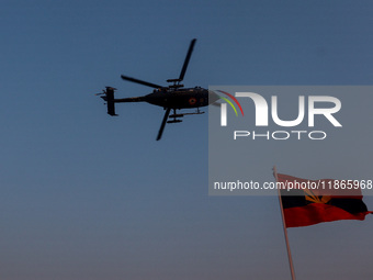 Indian army helicopters display maneuvers during a practice ahead of the Vijay Diwas celebration in Kolkata, India, on December 14, 2024. (