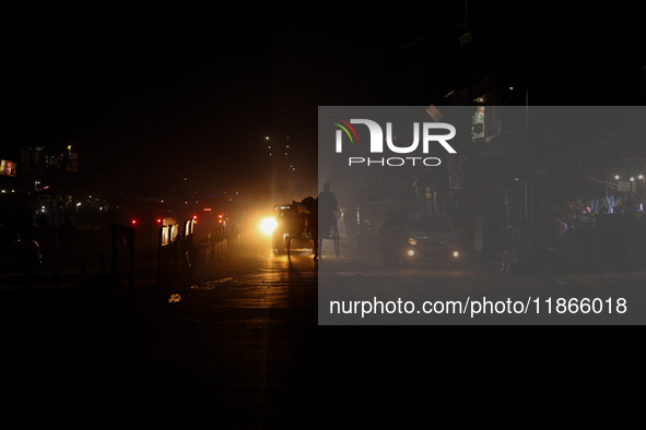 A man rides a horse cart on a cold winter evening in Sopore, Jammu and Kashmir, India, on December 14, 2024. 