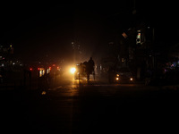 A man rides a horse cart on a cold winter evening in Sopore, Jammu and Kashmir, India, on December 14, 2024. (