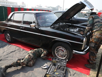 Indian Army personnel repair a vintage car during the full dress rehearsal ahead of ''Vijay Diwas,'' a ceremony to celebrate the liberation...