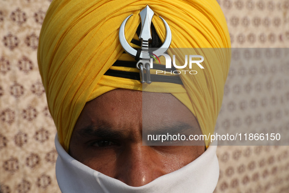 An Indian Army personnel waits before performing during the full dress rehearsal ahead of ''Vijay Diwas,'' a ceremony to celebrate the liber...