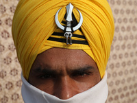 An Indian Army personnel waits before performing during the full dress rehearsal ahead of ''Vijay Diwas,'' a ceremony to celebrate the liber...