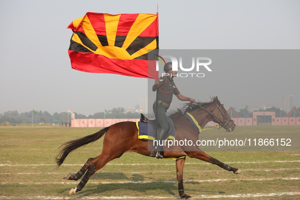 An Indian army soldier demonstrates his skills with his horse during the full dress rehearsal ahead of ''Vijay Diwas,'' a ceremony to celebr...