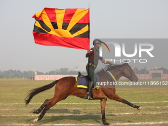 An Indian army soldier demonstrates his skills with his horse during the full dress rehearsal ahead of ''Vijay Diwas,'' a ceremony to celebr...