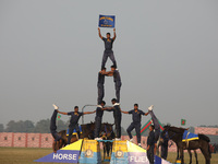 Indian army soldiers perform a stunt during the full dress rehearsal ahead of ''Vijay Diwas,'' a ceremony to celebrate the liberation of Ban...