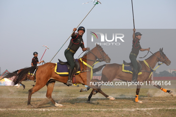 An Indian army soldier demonstrates his skills with his horse during the full dress rehearsal ahead of ''Vijay Diwas,'' a ceremony to celebr...