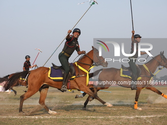 An Indian army soldier demonstrates his skills with his horse during the full dress rehearsal ahead of ''Vijay Diwas,'' a ceremony to celebr...