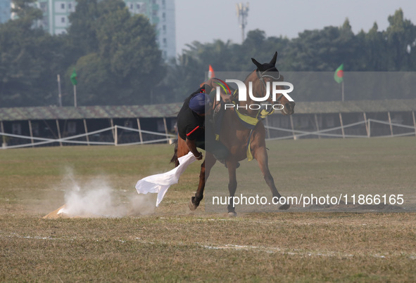 An Indian army soldier demonstrates his skills with his horse during the full dress rehearsal ahead of ''Vijay Diwas'', a ceremony to celebr...