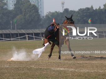 An Indian army soldier demonstrates his skills with his horse during the full dress rehearsal ahead of ''Vijay Diwas'', a ceremony to celebr...