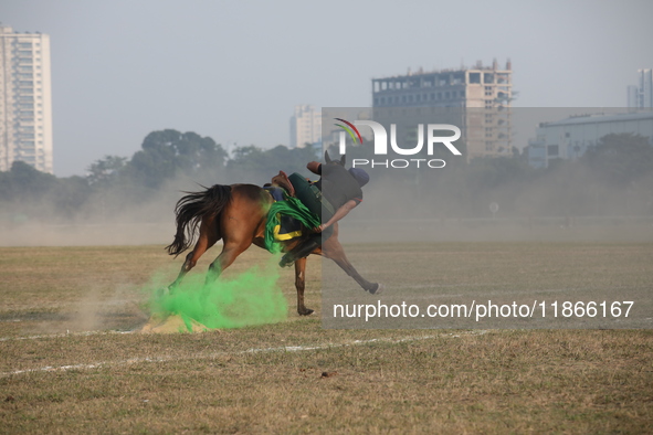 An Indian army soldier demonstrates his skills with his horse during the full dress rehearsal ahead of ''Vijay Diwas'', a ceremony to celebr...