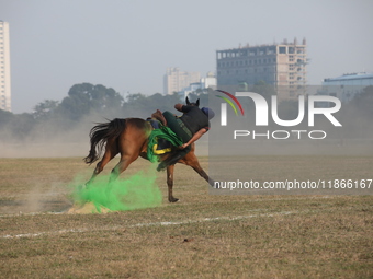 An Indian army soldier demonstrates his skills with his horse during the full dress rehearsal ahead of ''Vijay Diwas'', a ceremony to celebr...