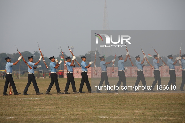 The Indian Air Force (IAF) officers perform a drill during the full dress rehearsal ahead of ''Vijay Diwas,'' a ceremony to celebrate the li...