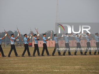 The Indian Air Force (IAF) officers perform a drill during the full dress rehearsal ahead of ''Vijay Diwas,'' a ceremony to celebrate the li...