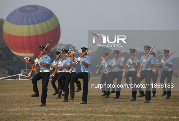 The Indian Air Force (IAF) officers perform a drill during the full dress rehearsal ahead of ''Vijay Diwas,'' a ceremony to celebrate the li...