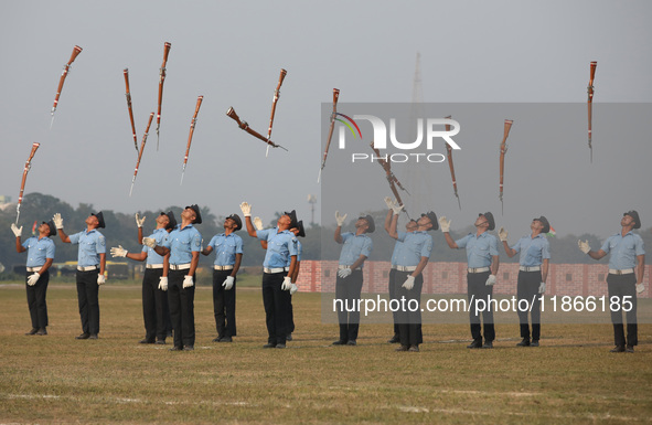 The Indian Air Force (IAF) officers perform a drill during the full dress rehearsal ahead of ''Vijay Diwas,'' a ceremony to celebrate the li...