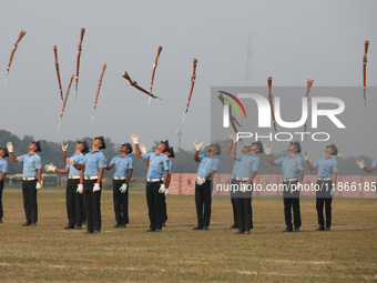 The Indian Air Force (IAF) officers perform a drill during the full dress rehearsal ahead of ''Vijay Diwas,'' a ceremony to celebrate the li...