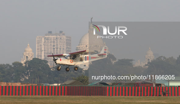 A plane flies past the iconic Victoria Memorial during the full dress rehearsal ahead of ''Vijay Diwas,'' a ceremony to celebrate the libera...