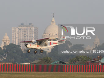 A plane flies past the iconic Victoria Memorial during the full dress rehearsal ahead of ''Vijay Diwas,'' a ceremony to celebrate the libera...