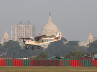 A plane flies past the iconic Victoria Memorial during the full dress rehearsal ahead of ''Vijay Diwas,'' a ceremony to celebrate the libera...