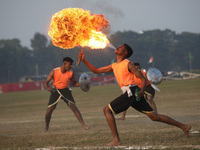 An Indian army soldier blows fire from his mouth as he performs during the full dress rehearsal ahead of ''Vijay Diwas'', a ceremony to cele...