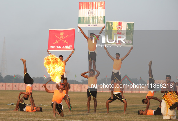 Indian army soldiers perform a stunt during the full dress rehearsal ahead of ''Vijay Diwas,'' a ceremony to celebrate the liberation of Ban...