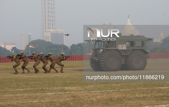 Indian army soldiers demonstrate their skills during the full dress rehearsal ahead of ''Vijay Diwas,'' a ceremony to celebrate the liberati...