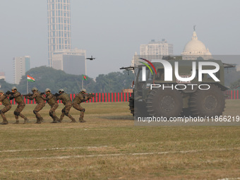 Indian army soldiers demonstrate their skills during the full dress rehearsal ahead of ''Vijay Diwas,'' a ceremony to celebrate the liberati...