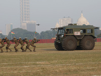 Indian army soldiers demonstrate their skills during the full dress rehearsal ahead of ''Vijay Diwas,'' a ceremony to celebrate the liberati...