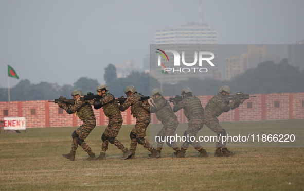 Indian army soldiers demonstrate their skills during the full dress rehearsal ahead of ''Vijay Diwas,'' a ceremony to celebrate the liberati...