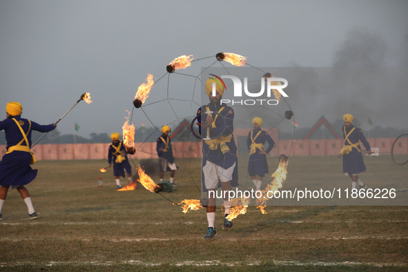 Indian army soldiers perform during the full dress rehearsal ahead of ''Vijay Diwas'', a ceremony that celebrates the liberation of Banglade...