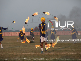 Indian army soldiers perform during the full dress rehearsal ahead of ''Vijay Diwas'', a ceremony that celebrates the liberation of Banglade...