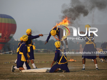 An Indian army soldier performs a stunt during the full dress rehearsal ahead of ''Vijay Diwas,'' a ceremony to celebrate the liberation of...