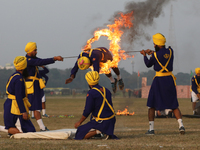 An Indian army soldier performs a stunt during the full dress rehearsal ahead of ''Vijay Diwas,'' a ceremony to celebrate the liberation of...