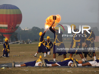 An Indian army soldier performs a stunt during the full dress rehearsal ahead of ''Vijay Diwas,'' a ceremony to celebrate the liberation of...