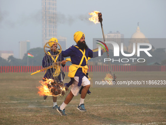 Indian army soldiers perform during the full dress rehearsal ahead of ''Vijay Diwas'', a ceremony that celebrates the liberation of Banglade...