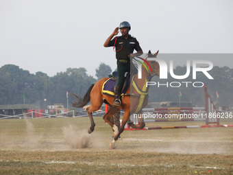 An Indian army soldier demonstrates his skills with his horse during the full dress rehearsal ahead of ''Vijay Diwas,'' a ceremony to celebr...