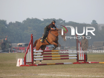 An Indian army soldier demonstrates his skills with his horse during the full dress rehearsal ahead of ''Vijay Diwas,'' a ceremony to celebr...