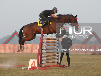 An Indian army soldier demonstrates his skills with his horse during the full dress rehearsal ahead of ''Vijay Diwas,'' a ceremony to celebr...