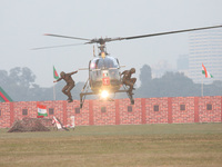 Indian army soldiers demonstrate their skills with a helicopter during the full dress rehearsal ahead of ''Vijay Diwas,'' a ceremony to cele...