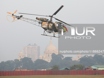 Indian army soldiers demonstrate their skills with a helicopter during the full dress rehearsal ahead of ''Vijay Diwas,'' a ceremony to cele...