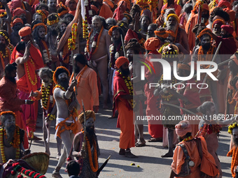 Hindu sadhus (holy men) from the Juna Akhara take part in a religious procession towards the Sangam area during the first entry for the Maha...