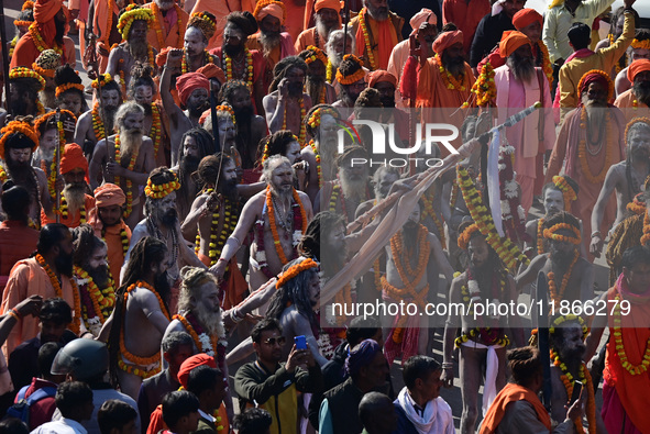 Hindu sadhus (holy men) from the Juna Akhara take part in a religious procession towards the Sangam area during the first entry for the Maha...