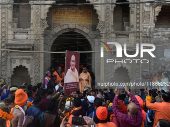 Hindu sadhus (holy men) from the Juna Akhara take part in a religious procession towards the Sangam area during the first entry for the Maha...