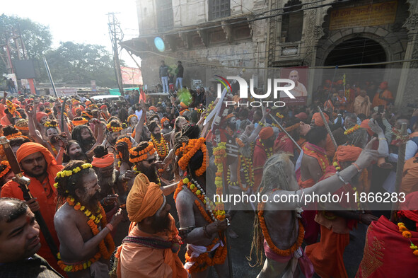 Hindu sadhus (holy men) from the Juna Akhara take part in a religious procession towards the Sangam area during the first entry for the Maha...