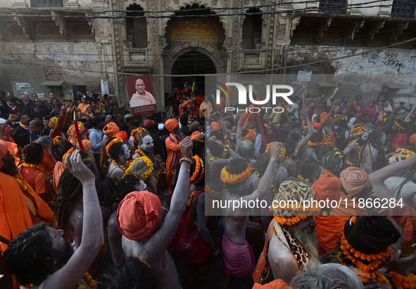 Hindu sadhus (holy men) from the Juna Akhara take part in a religious procession towards the Sangam area during the first entry for the Maha...