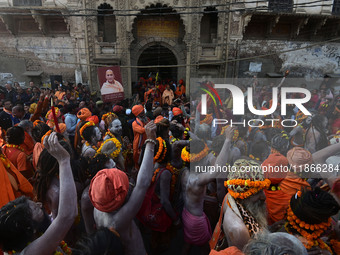 Hindu sadhus (holy men) from the Juna Akhara take part in a religious procession towards the Sangam area during the first entry for the Maha...